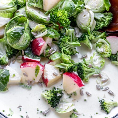 large plate of chilled broccoli and brussel sprouts salad