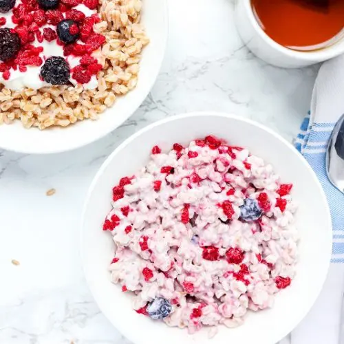 farro breakfast bowl mixed with berries and yogurt