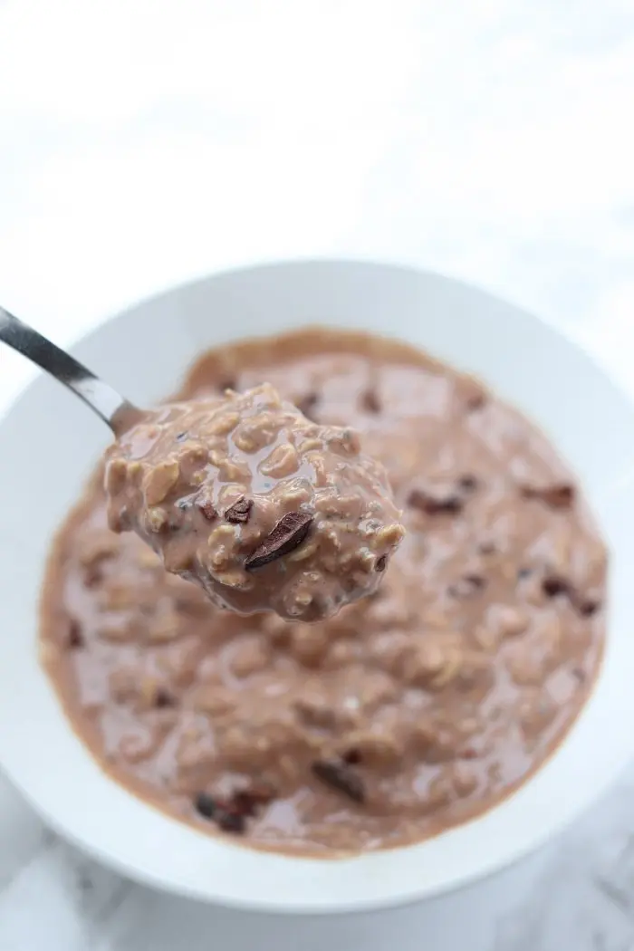 spoonful of chocolate oatmeal with cacao nibs