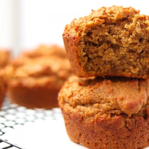 two muffins stacked on top of each other on a baking rack