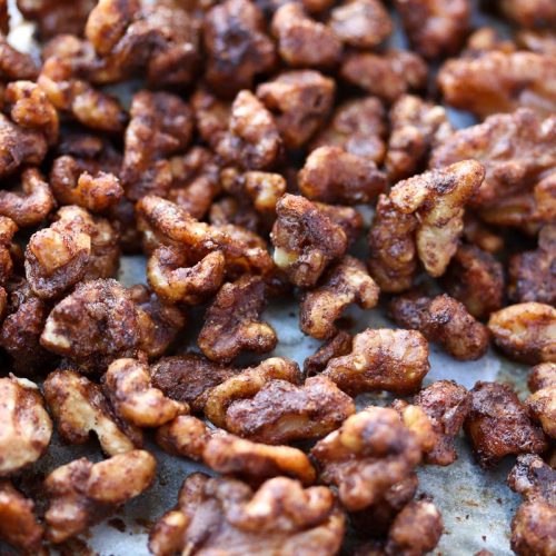baking pan of sweet and spicy roasted walnuts