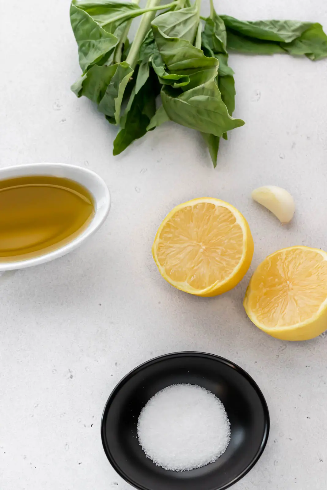 basil leaves, lemons, garlic and olive oil