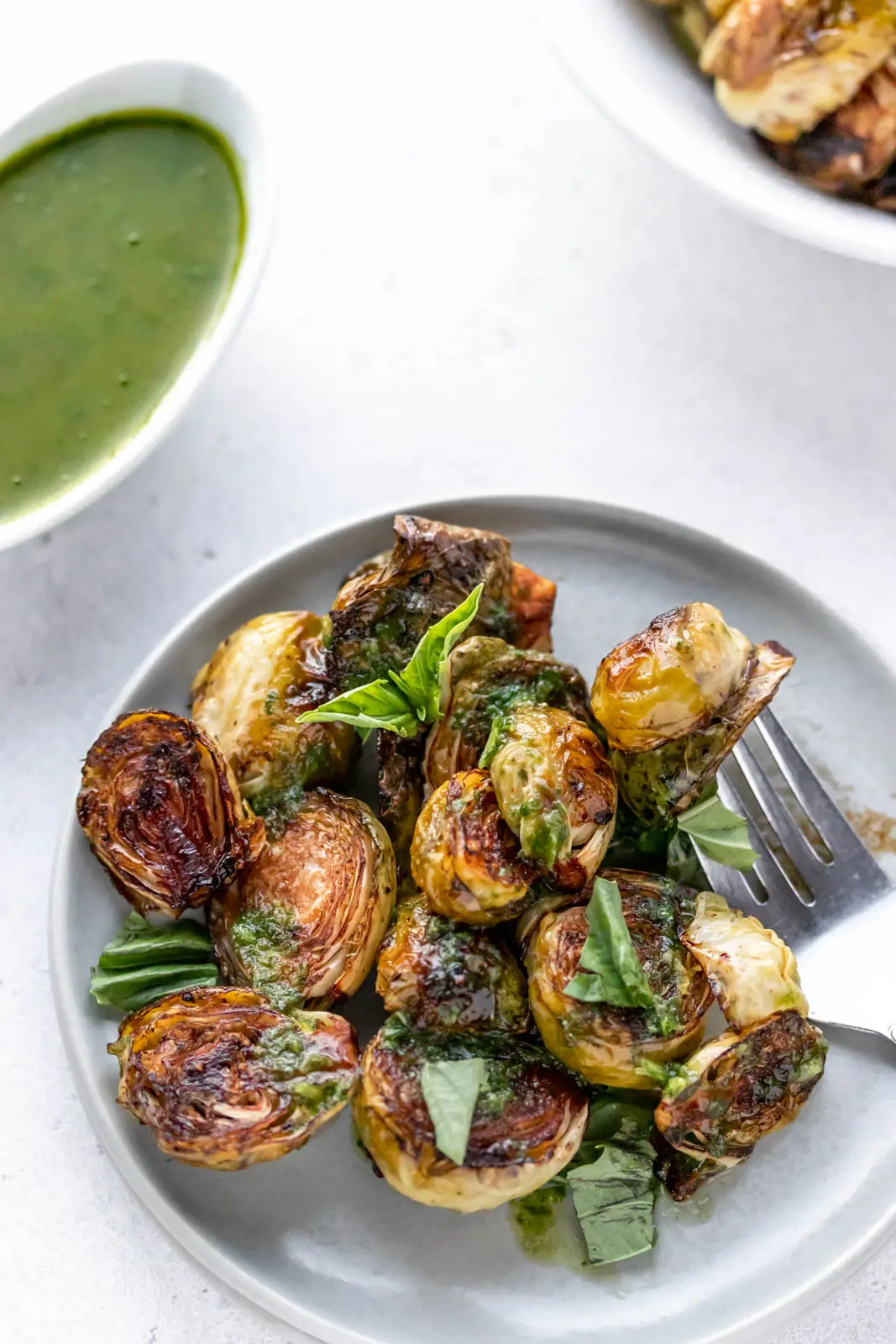 fork holding a cooked brussels sprout