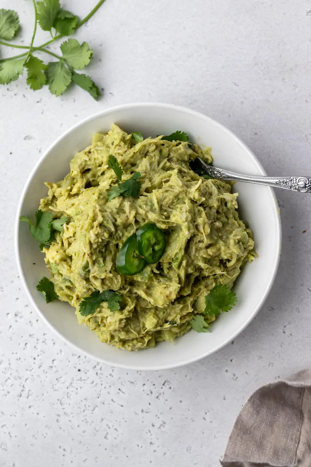 avocado chicken salad garnished with cilantro