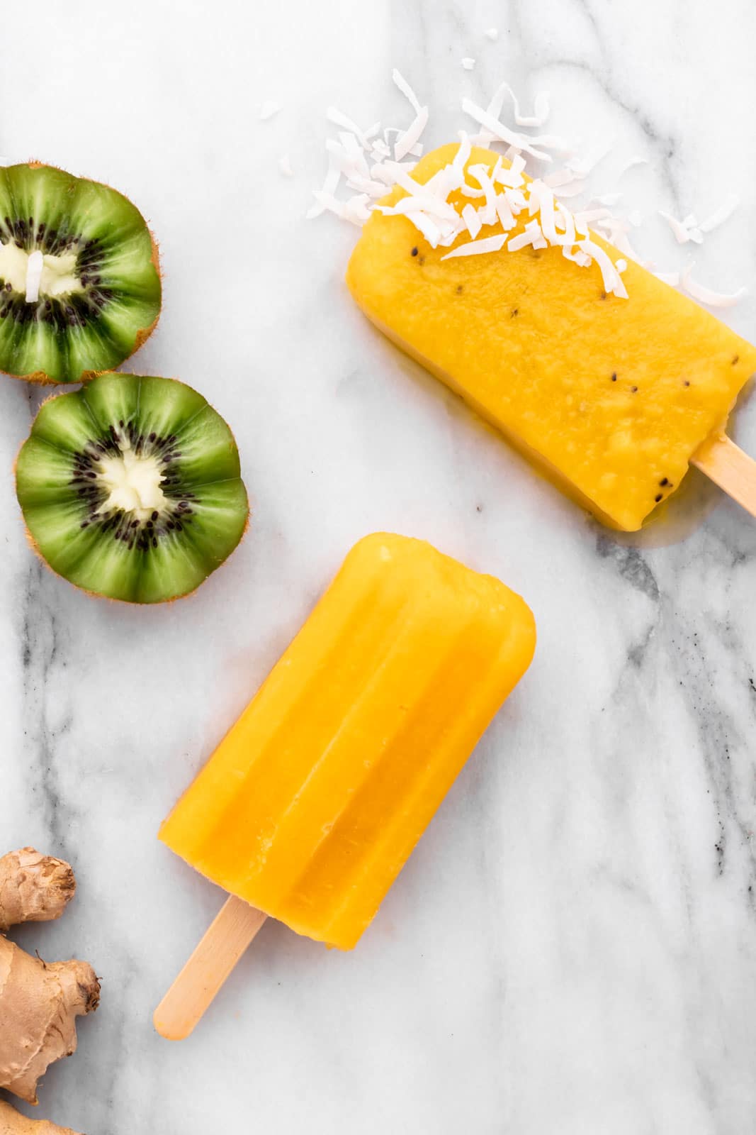 coconut flakes on a mango popsicle