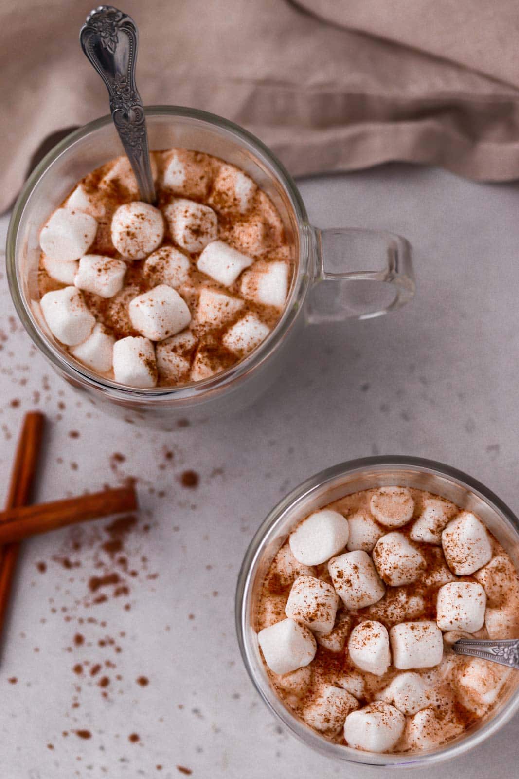 two mugs of hot chocolate and marshmallows