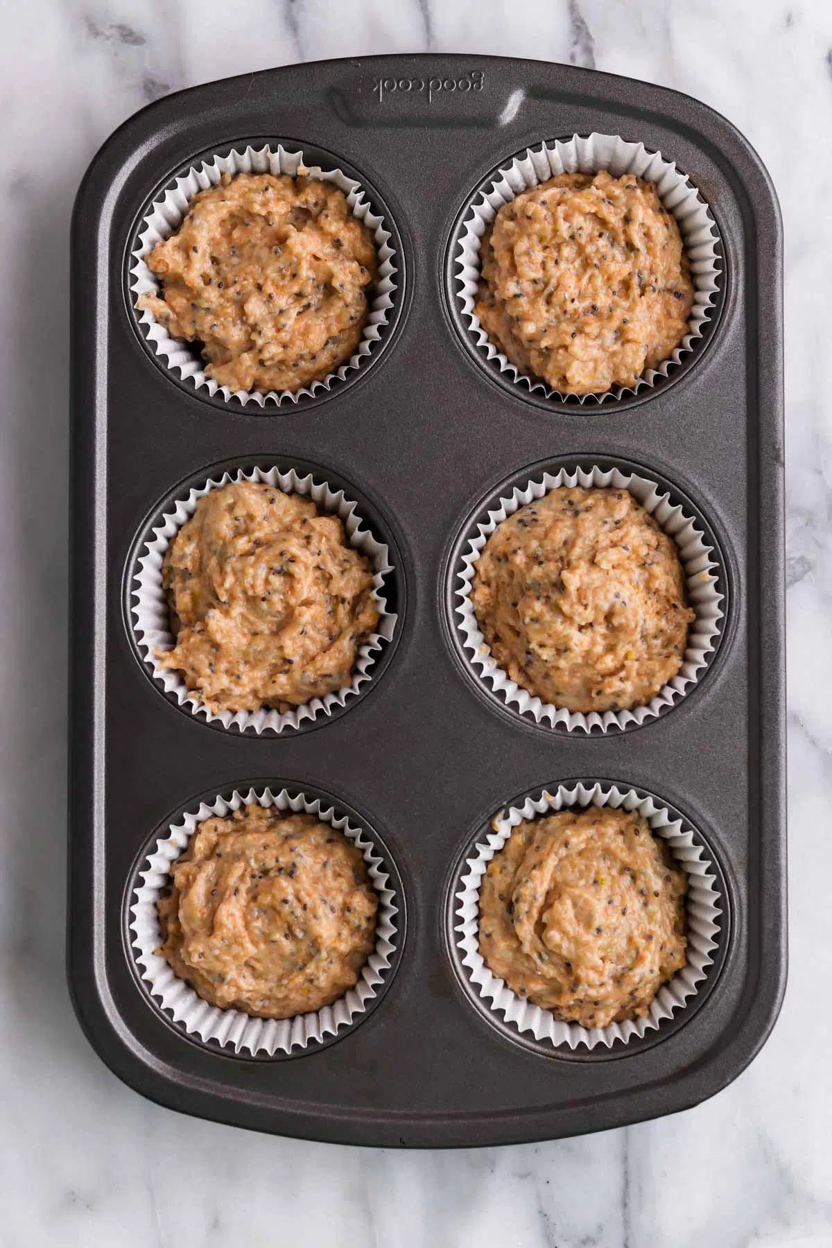 lemon muffin batter in muffin tins