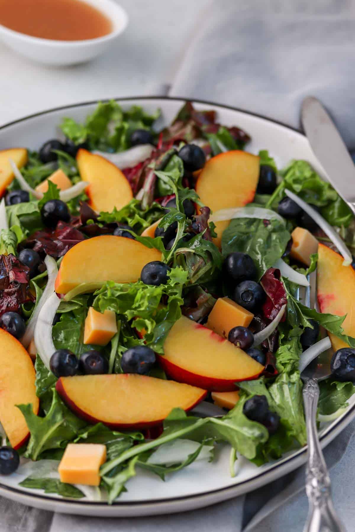 gouda cheese on salad with peaches