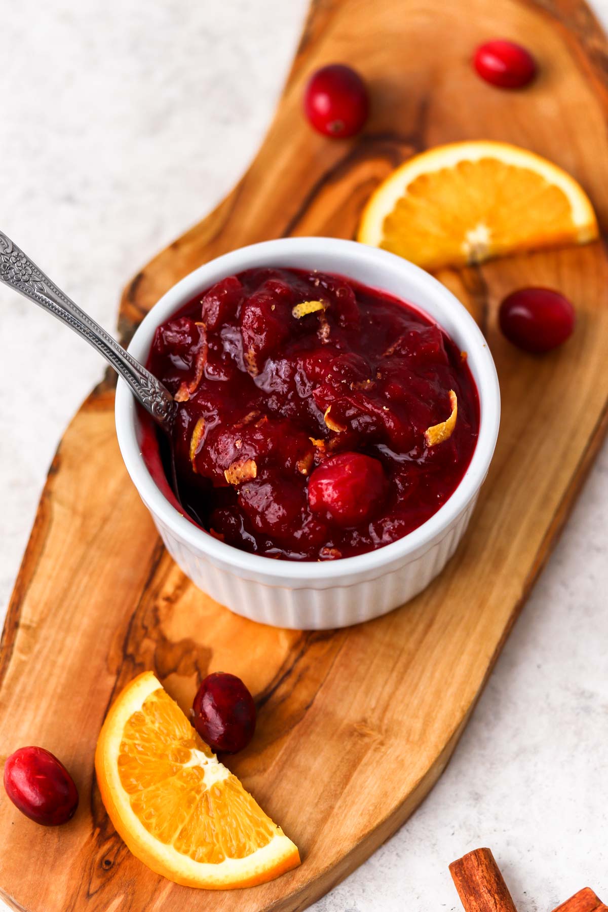 spoon in cranberry sauce with orange zest