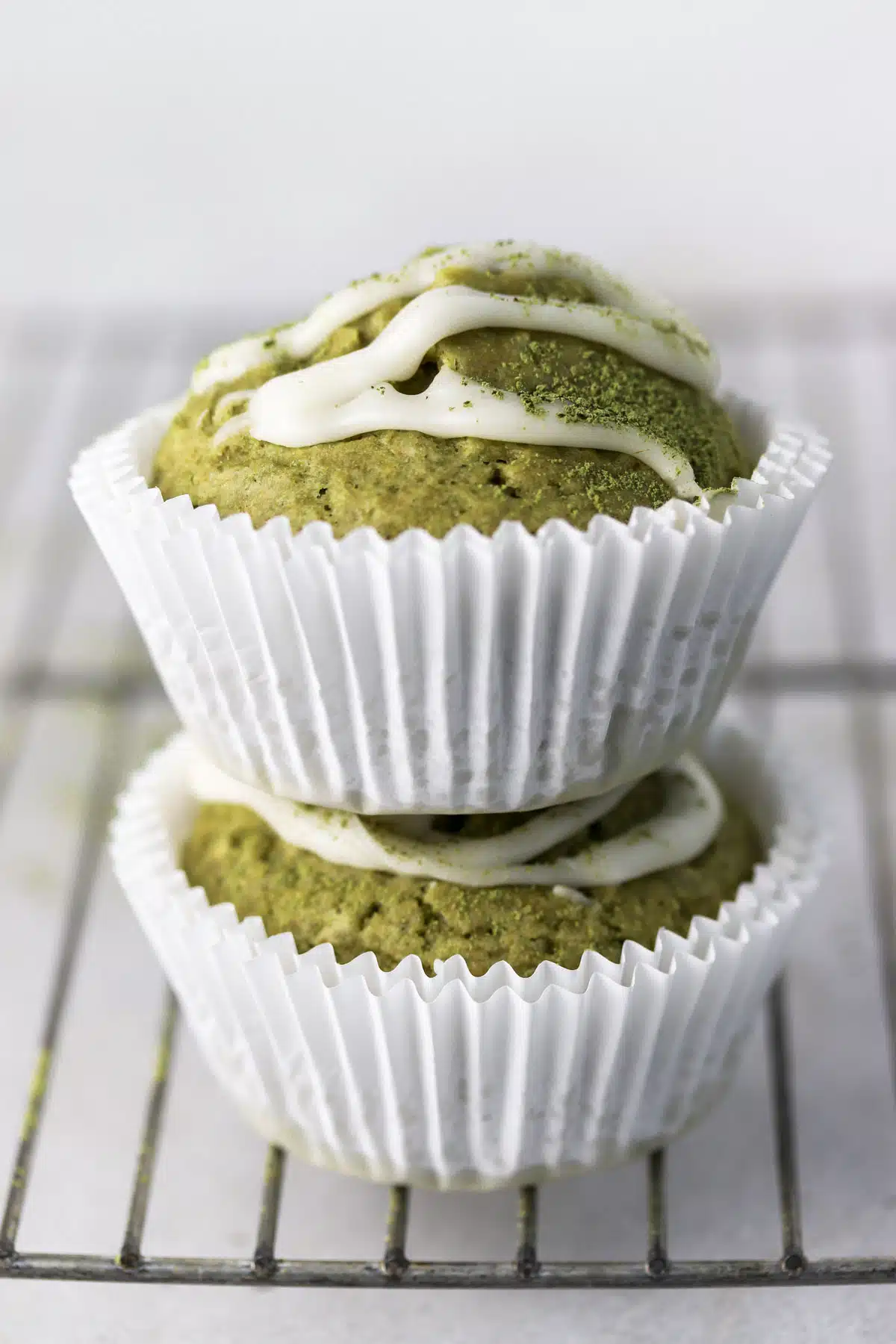 two green muffins stacked