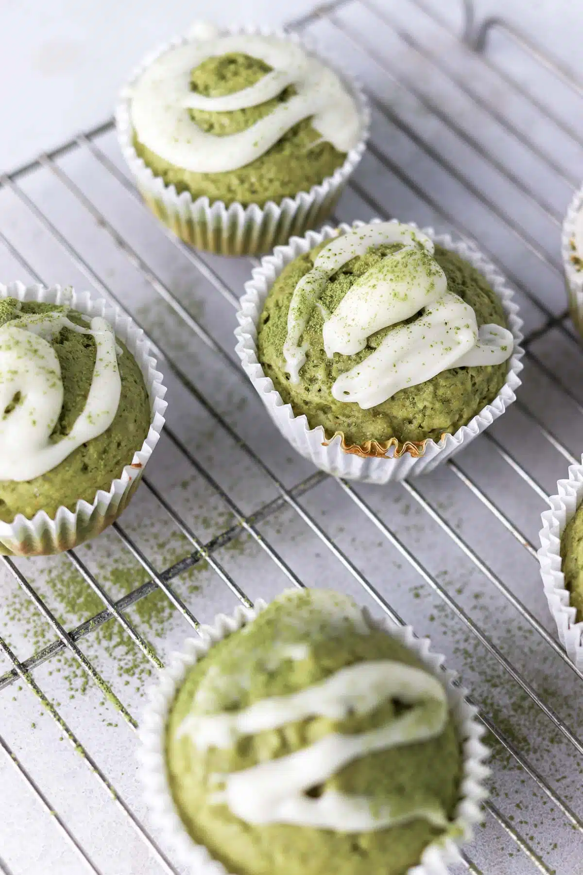 green muffins with drizzled icing