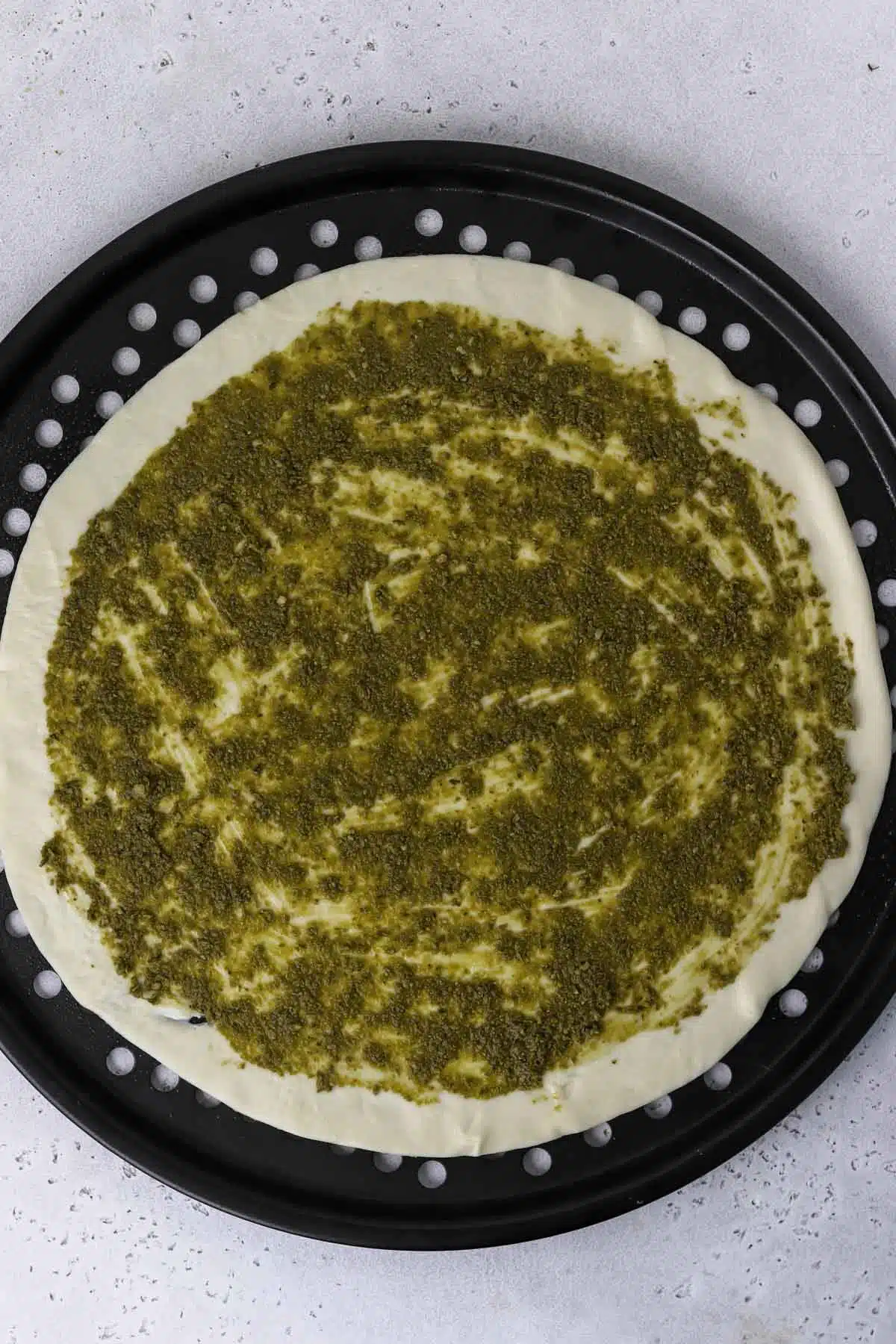 pesto on pizza dough