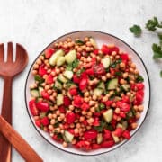Mediterranean Chickpea Salad with tongs