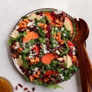 harvest salad with wooden salad utensils